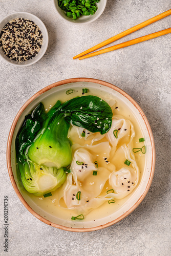 Soup with wontons and bok choy
