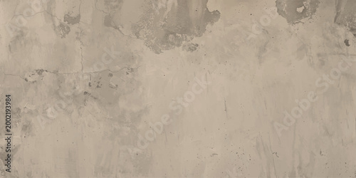 A textured beige and grey concrete surface featuring a rough, aged grunge pattern on a blank vintage plaster wall backdrop for an artful brown stone wallpaper design