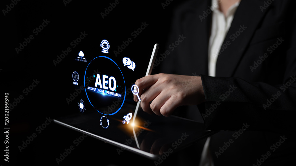 Obraz premium Business professional using digital tablet for data visualization and application development with modern user interface elements and icons in dark setting Fluxor.