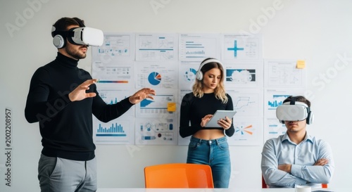 Team using VR headsets for business meeting and data analysis in modern office