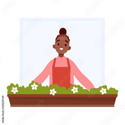 Woman gardering Flowers on Balcony