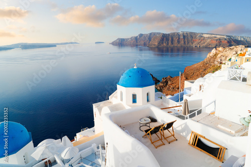blue domes and volcano caldera with deep sea landscape, beautiful details of Santorini island, Greece