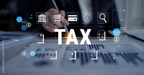 Foto Businessman Analyzing Financial Data with Tax Icons and Graphs on a Desk in an Office Environment Focused on Taxes and Financial Management Fluxor