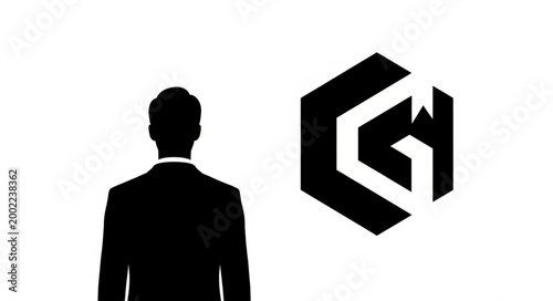 Silhouette of a businessman facing a geometric logo on a white background.