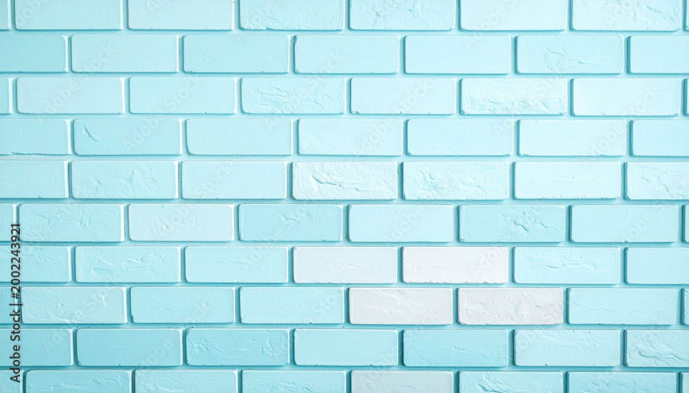 Obraz premium Light blue painted brick wall texture with soft gradient tones and subtle surface details, clean modern background ideal for design, architecture and minimal layouts.