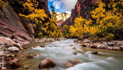 Autumn canyon river flow, golden trees, sunlit cliffs