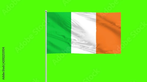 Ireland Flag on Green: An Irish flag, with its vibrant green, white, and orange stripes, flutters proudly against a vivid green backdrop, representing national identity.
