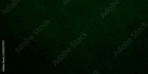 Deep forest green textured paper background with subtle grain and organic fiber details for elegant luxury backdrop.