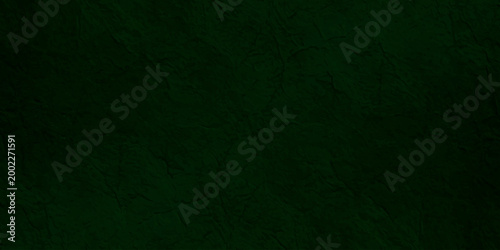 Deep forest green textured paper background with subtle grain and organic fiber details for elegant luxury backdrop.