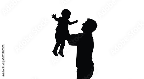 Silhouette of a man playfully lifting his joyful child in the air with love and care