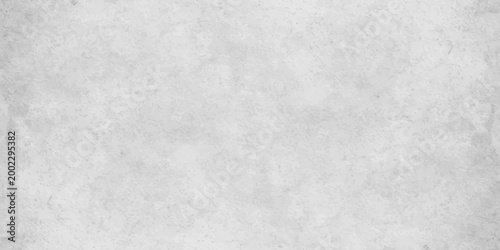 White concrete wall texture background with subtle grain and light grey distressed stone effect. white cement or plaster wall texture. light grey weathering and a fine granular surface