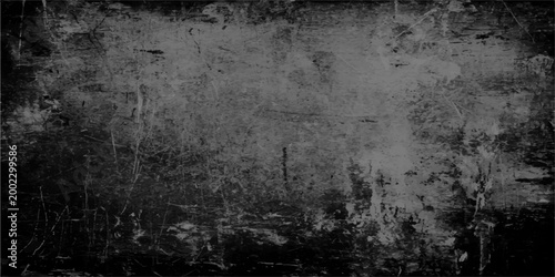 Grunge dark background. A textured image evocative of a rough or old surface. 