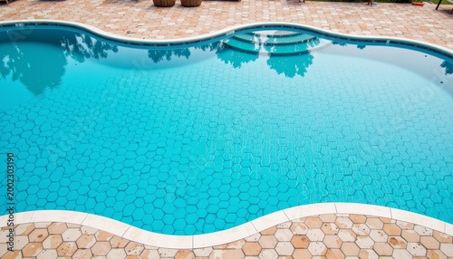 Serene Curved Pool with Unique Hexagonal Tile Pattern in Daylight