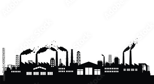 Industrial factory complex with smokestacks and buildings emitting smoke