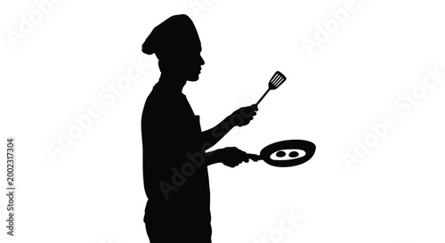 Silhouette of a chef holding a frying pan and spatula in a cooking pose standing tall