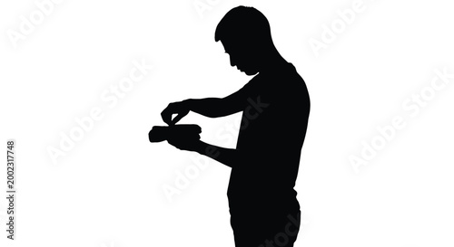 Man in silhouette tying shoelaces on a white background carefully