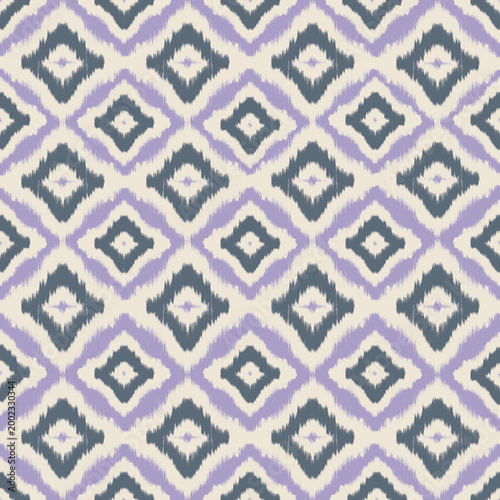 Seamless purple and teal ikat geometric pattern.