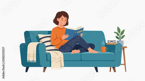 A moment of serenity is captured, with a woman immersed in reading, sitting on a teal sofa. Beside her, a cup of warm drink, and a small potted plant, adding to the tranquil atmosphere.