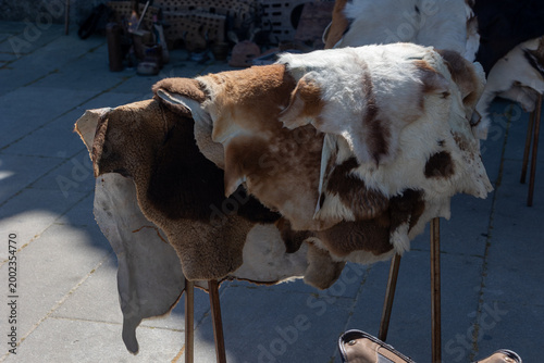 Fotografie Animal hides and furs drying at outdoor market