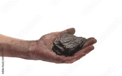 Man with dirty hand from dust holds lumps of black coal isolated on white background, clipping path,design element