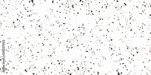 White terrazzo texture background with black and gray mineral flecks, seamless granite pattern. Minimalist white terrazzo background featuring a dense distribution of black and gray stone fragments.