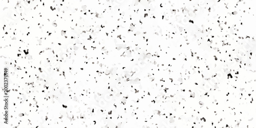 White terrazzo texture background with black and gray mineral flecks, seamless granite pattern. Minimalist white terrazzo background featuring a dense distribution of black and gray stone fragments.