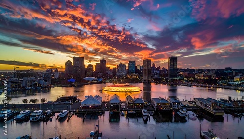 Vivid sunset over harbor city with illuminated structure