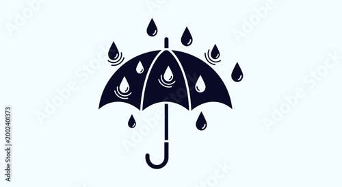 Black umbrella with raindrops falling.
