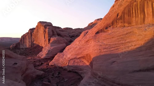 Ancient Rock Formations Focus on the intricate details and weathered textures of naturally sculpted geological structures illuminated by dawn.