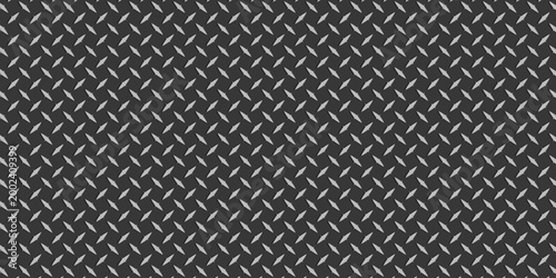 A simple pattern of dark metal with repeating diamond plate texture