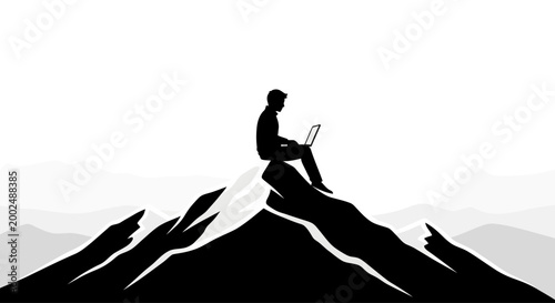 Man sitting on mountain with laptop.