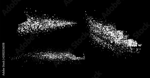 depicts white sugar on a black background. The sugar is presented in loose, granular forms, emphasizing its texture and detail. The minimalistic composition highlights the contrast between