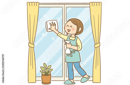 Young woman cleaning window glass with cloth at home / 窓掃除をする若い女性