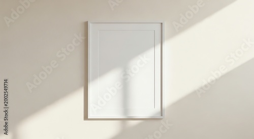 Blank picture frame, empty white wall, sunlight shadow, interior design element, home decor
