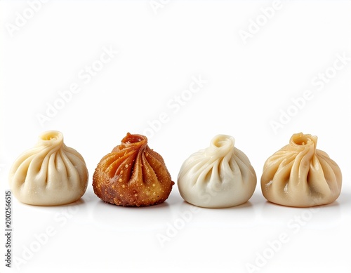 Assorted traditional Korean mandu dumplings on white background