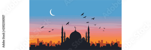 A golden sunset glows over the urban city skyline, casting a dramatic silhouette of an ancient mosque and architectural monuments across the Istanbul landscape during a peaceful travel evening in Asia