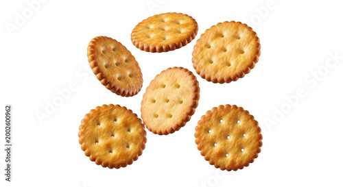 Group of crispy round salted crackers falling in the air isolated on transparent background