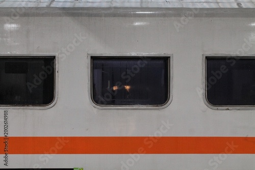 Foto Train Windows And Orange Stripe On Retro Passenger Carriage