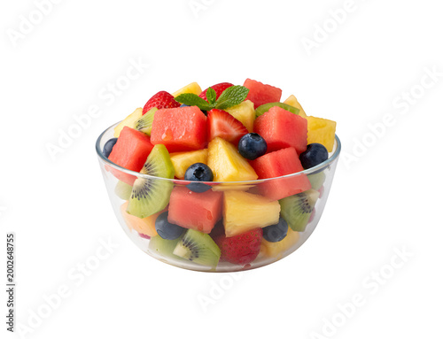 Fruit salad in a bowl. Fresh pieces of fruit for a nutritious breakfast, isolated on a white backdrop.