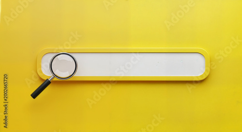 magnifying glass on yellow clipboard