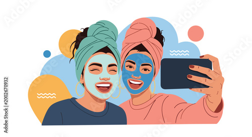 Happy young women with cosmetic face masks and towels on their heads taking a selfie during a spa day at home.