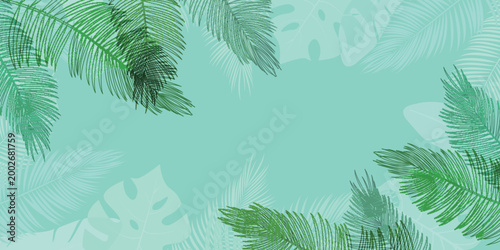 Tropical palm leaf border frame on a soft mint green background