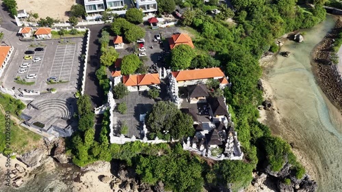 Aerial View of Pura Geger Dalem Pemutih Temple on a Rock Cliff by the Ocean in Bali