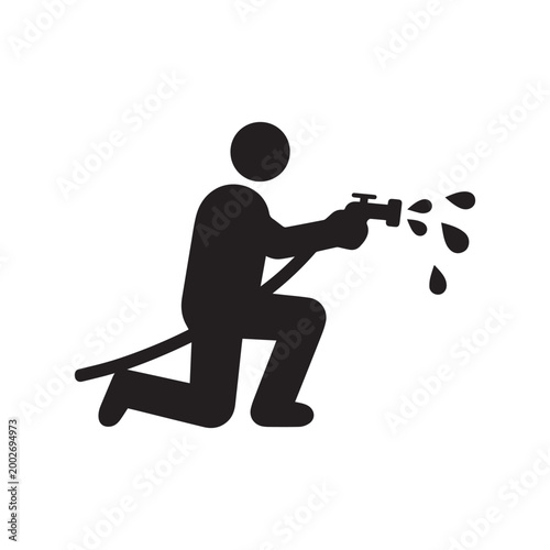 Person Kneeling While Using a High Pressure Water Hose with Nozzle Spray.