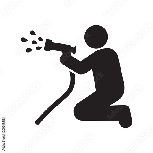 Person Kneeling While Using a High Pressure Water Hose with Nozzle Spray.