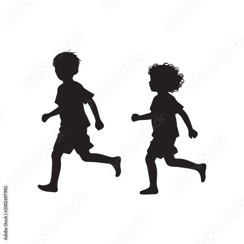 Silhouette of Two Young Boys Running and Playing Together in Active Motion.