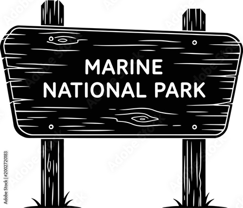 Signboard with a marine national park label illustrates the boundary of a protected coastal region.