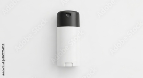 White and black cylindrical container, likely for toiletries, on white background