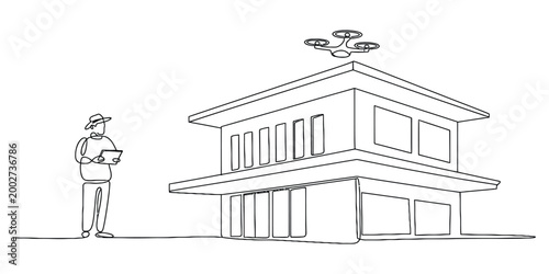 Man controlling drone near modern building