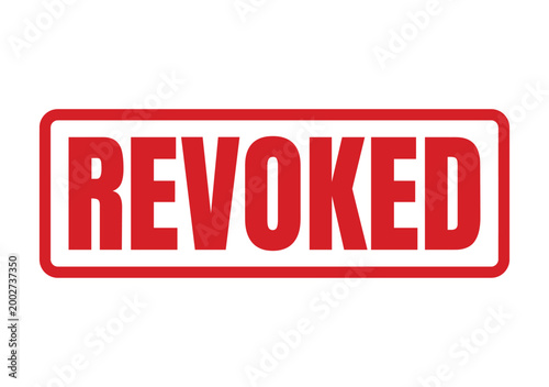 Fotografija A bright red inked rubber stamp showing the word revoked for official legal docu